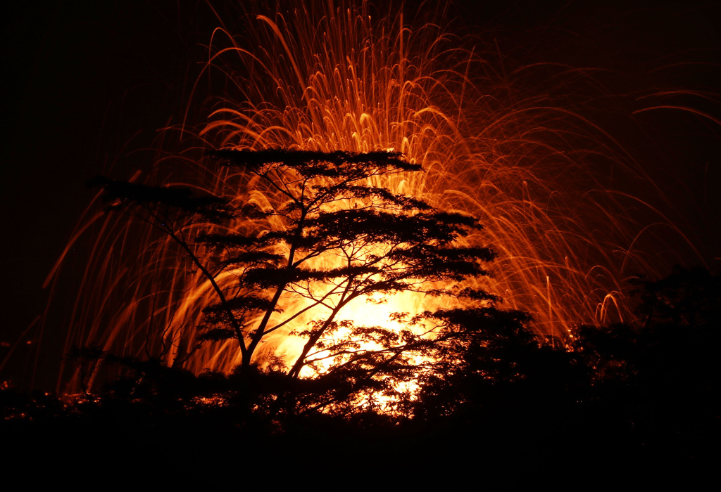 Hawaii's Kilauea Volcano Erupts Forcing Evacuations Lava erupts from a Kilauea volcano fissure, above treetops, on Hawaii's Big Island on May 17, 2018 in Kapoho, Hawaii.