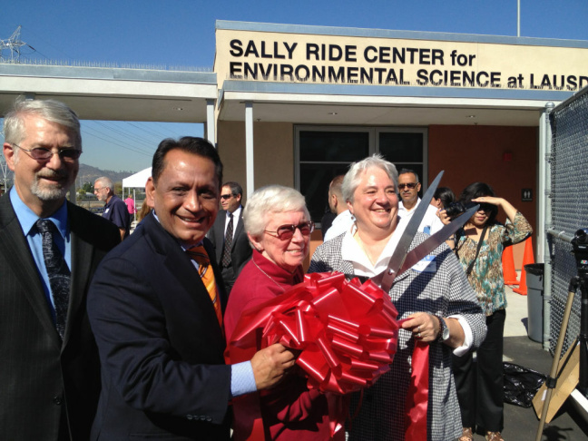 The late astronaut Sally Ride's mother Joyce Ride and her sister Bear Ride help with the ribbon-cutting on The Sally Ride Center for Environmental Science at L.A. Unified. Democratic Assemblyman Gil Cedillo of Los Angeles helps hold the scissors. School board member Bennett Kayser looks on.