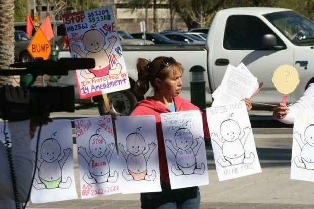 A protestor outside the Arizona state Capitol in Phoenix yesterday, February 7, 2011