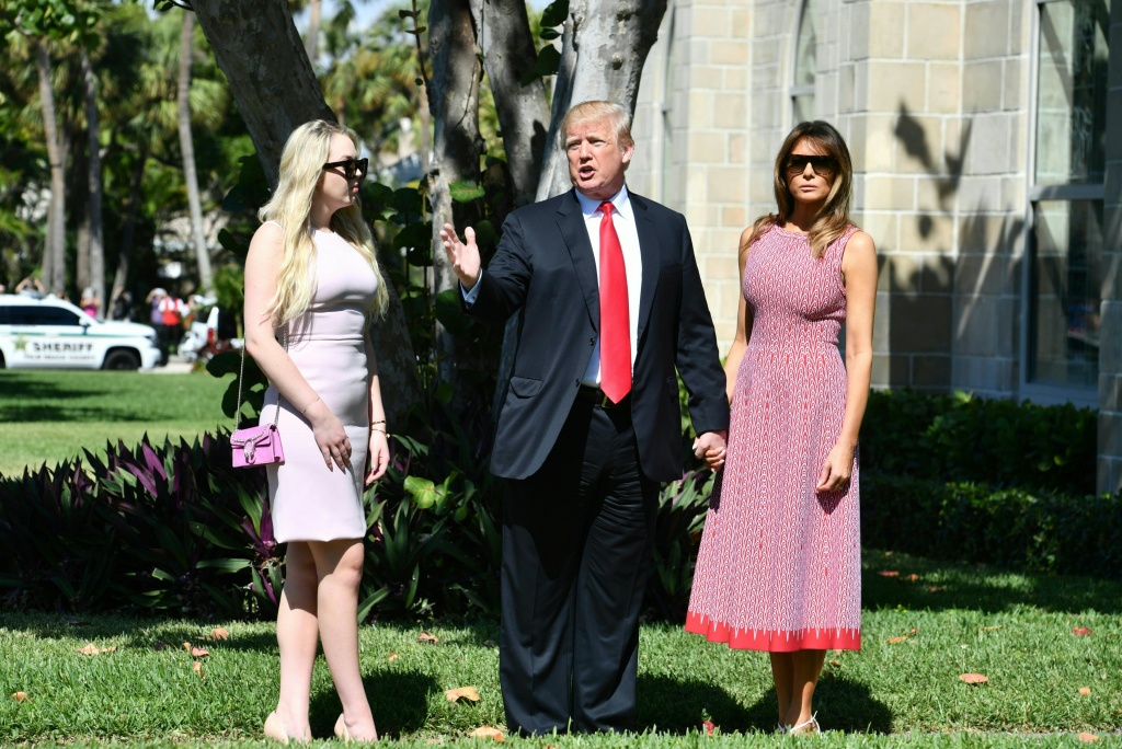 US-POLITICS-TRUMP-EASTER U.S. President Donald Trump, First Lady Melania Trump and daughter Tiffany Trump arrive for Easter services at the Church of Bethesda-by-the-Sea in Palm Beach, Florida, April 1, 2018.