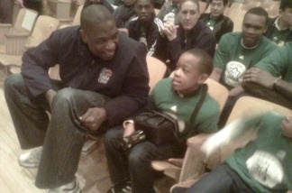 Former NBA All-Star center Dikembe Mutombo visits with Virgil Middle School near Downtown Los Angeles.