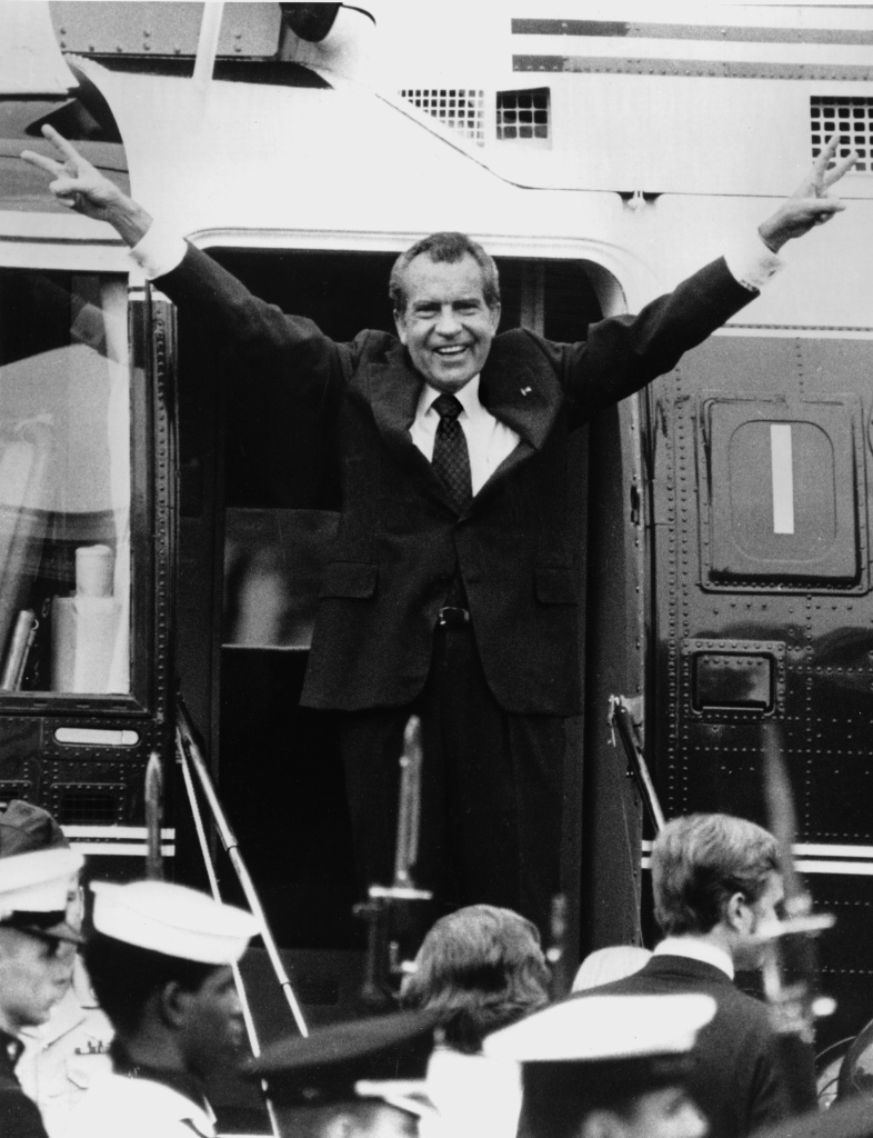 Richard Nixon says goodbye to his staff members outside the White House as he boards a helicopter after resigning the presidency on Aug. 9, 1974.
