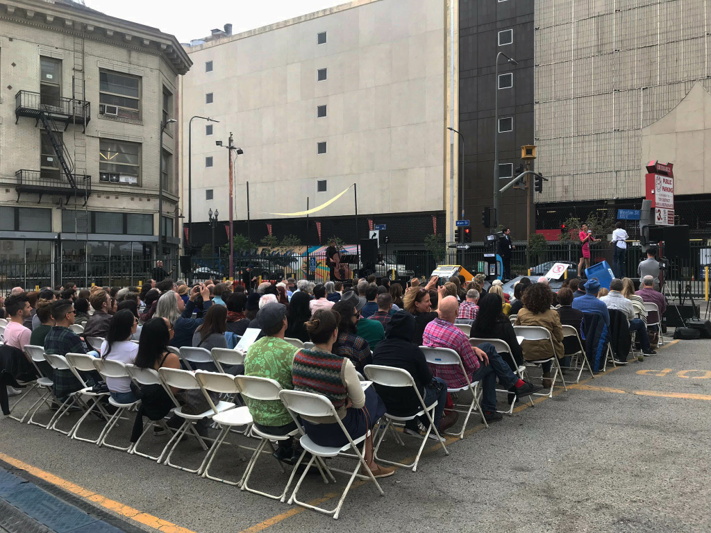 A crowd watched actors who played reporter Hector G. Wallace of WOTW TV and Dr. Melissa Morse, KCRW’s head meteorologist. They asked an eyewitness questions about the mysterious explosions and flashes of green light. Photo credit: Adriana Cargill A crowd watched actors who played reporter Hector G. Wallace of WOTW TV and Dr. Melissa Morse, KCRW’s head meteorologist. They asked an eyewitness questions about the mysterious explosions and flashes of green light. Photo credit: Adriana Cargill