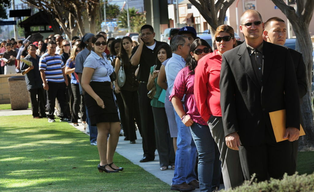 California's unemployment rate increased slightly to 8.7 percent in July, the first such bump since the spring of 2011, state officials announced Friday. The rate from 8.5 percent in June. (File photo: Unemployed Americans line up to enter a job fair in El Monte, Calif.)