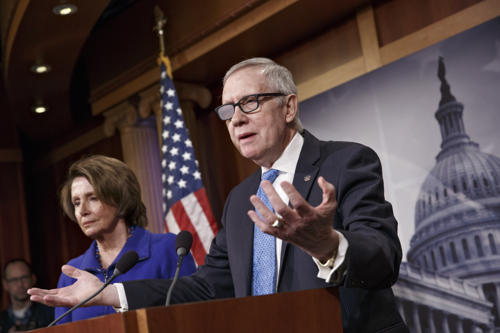 Congress Homeland Senate Minority Leader Harry Reid of Nev., accompanied by House Minority Leader Nancy Pelosi of Calif., gestures during a news conference on Capitol Hill in Washington, Thursday, Feb. 26, 2015, talks about the impasse over passing the Homeland Security budget because of Republican efforts to block President Barack Obama's executive actions on immigration. Reid suffered injuries after a violent exercise accident in December. (AP Photo/J. Scott Applewhite)