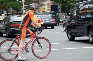 Mercer 16154 A bicyclist braving traffic.
