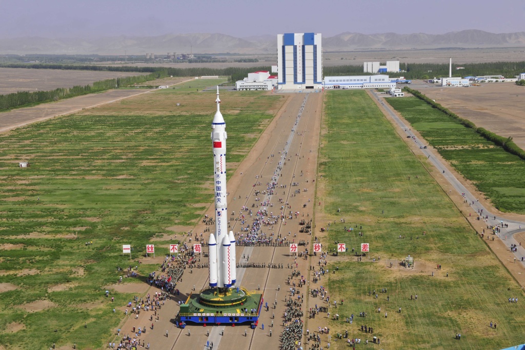 CHINA-SPACE-SHENZHOU X The Shenzhou X spacecraft carried by a Long March-2F carrier rocket is installed at the launch pad in Jiuquan, Northwest China's Gansu province in the morning of June 3, 2013. The spacecraft will carry three astronauts to visit the Tiangong-1 space module.