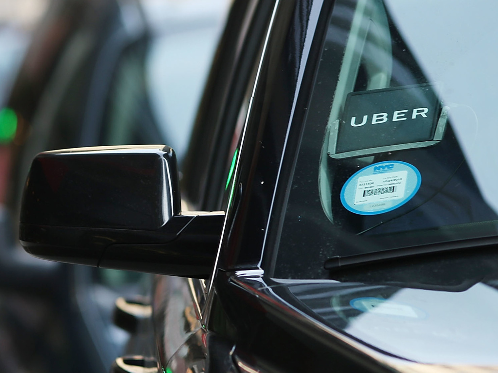 An Uber waits for a client in New York City. The company is partnering with health care organizations to provide patients with reliable transportation.