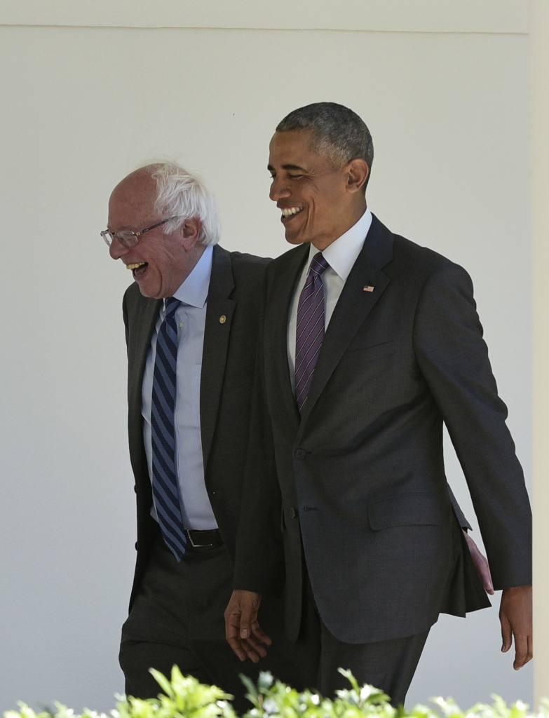 US-VOTE-DEMOCRATS-OBAMA-SANDERS President Barack Obama (R) walks with Democratic presidential candidate Bernie Sanders through the Colonnade for a meeting in the Oval Office on June 9, 2016 at the White House in Washington, D.C.