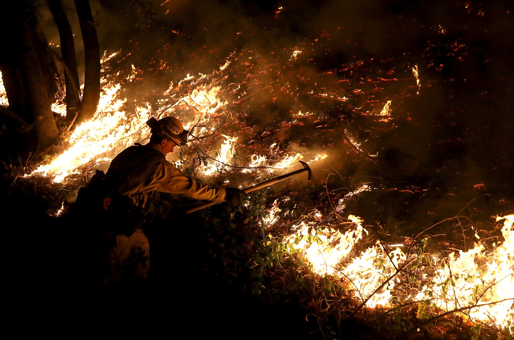 Multiple Wildfires Destroy Homes, Threaten California Wine Country A CalFire firefighter battles the Tubbs Fire on October 12, 2017 near Calistoga, California.