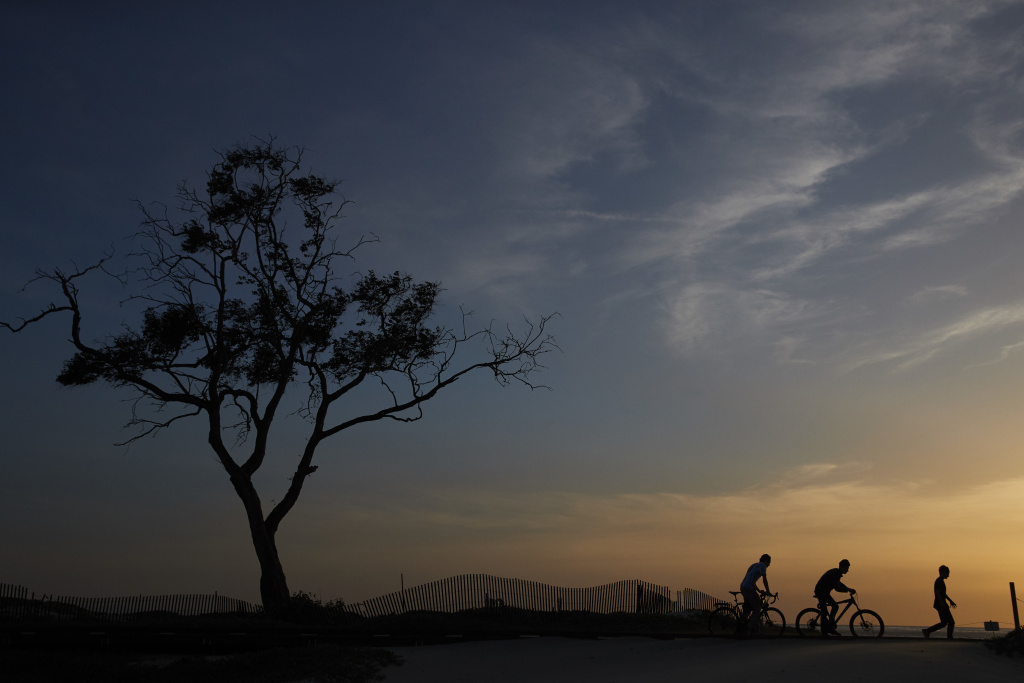 From Flowers to Pot In this Thursday, April 12, 2018 photo, three boys stroll along the beach in Carpinteria. The town, about 85 miles northwest of Los Angeles, is located on the bottom of Santa Barbara County, a tourist area famous for its beaches, wine and temperate climate. It's also gaining notoriety as a haven for cannabis growers.