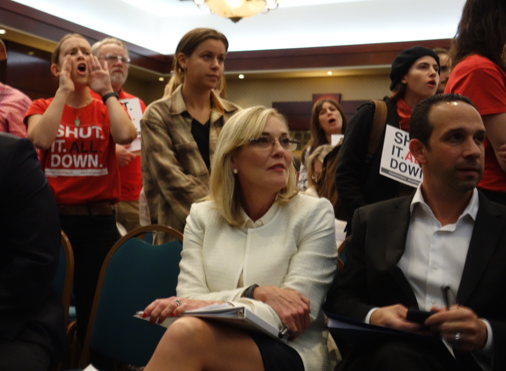 Barger and Englander Los Angeles County Supervisor Kathryn Barger and City Councilman Mitchell Englander remain seated while at a public meeting around them, opponents shout support for the permanent shutdown of Southern California Gas Company's Aliso Canyon natural gas storage field near Porter Ranch.