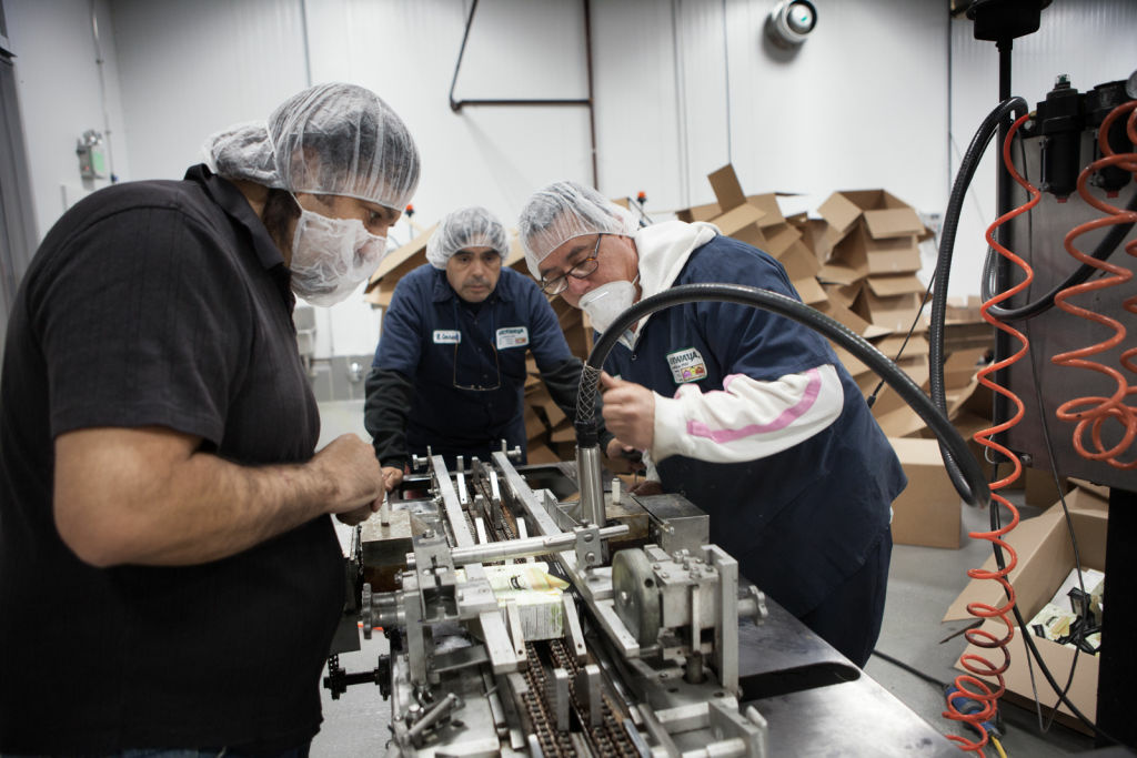 Rebounding from a weak March performance, the Commerce Department said Wednesday that orders to U.S. factories rose 1 percent in April. (Photo: Employees at the Mikawaya factory inspect a broken piece of machinery at the Vernon, Calif. facility.)