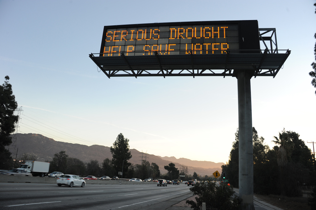 US-CALIFORNIA-WATER-DROUGHT A sign over a highway in Glendale, California warns motorists to save water in response to the state's severe drought, Feb. 14, 2014. Two new bills will help Californians save water long-term, not just during a drought emergency.