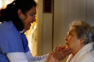 United HomeCare Services home health aide Wendy Cerrato talks with Olga Socarras during a visit on January 6, 2010 in Miami, Florida.